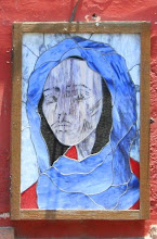 A Stained Glass Window on a Wall Near the Jardin