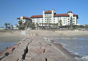 At some point in the hotel's history, a young woman checked into room number . (hotel galvez with seawall)