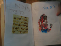 two pages of preschool haggadah, with hand-print and square of matzah paper.