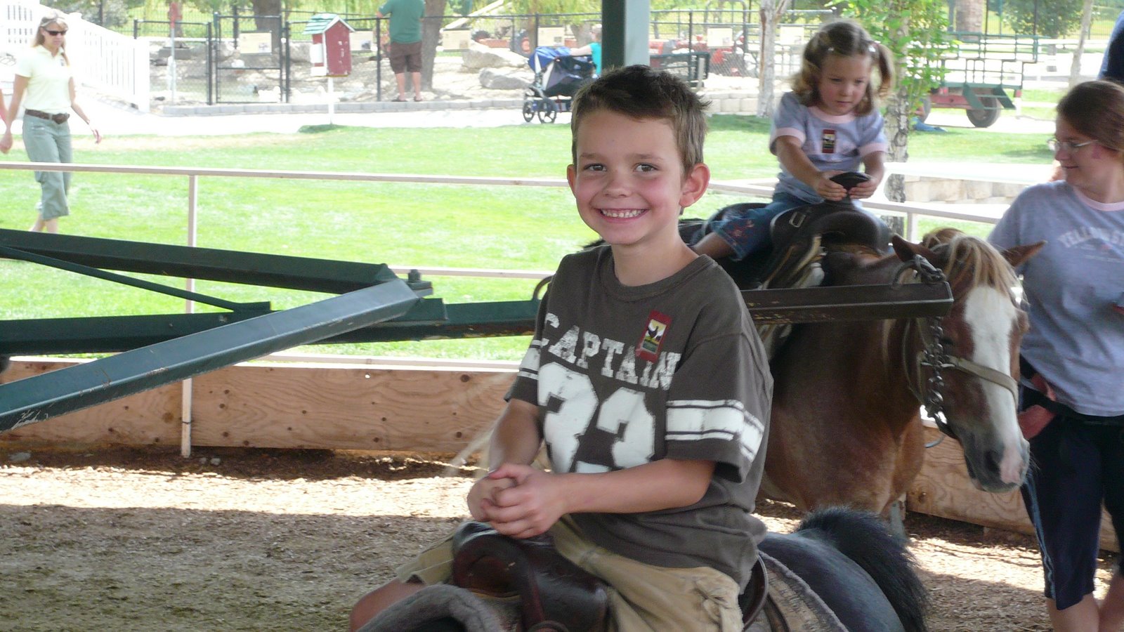 Josh riding a horse in Farm Country