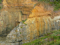 Triassic sandstones overlie Jurassic dolerite, note the dolerite is highly fractured, which has assisted the sea in forming the sea caves - 19th August 2008