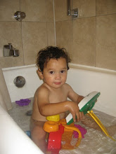 Mateo with his bath toys