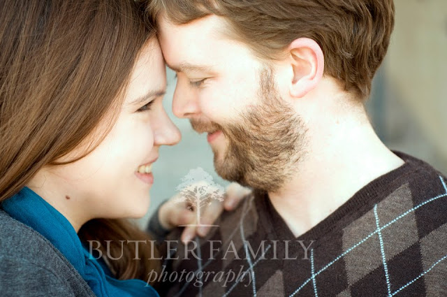 Close up view of the couple touching foreheads and smiling at eachother