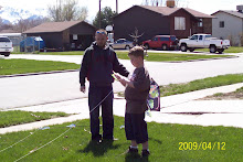 Freddy and Wylie tryin' out his new kite.