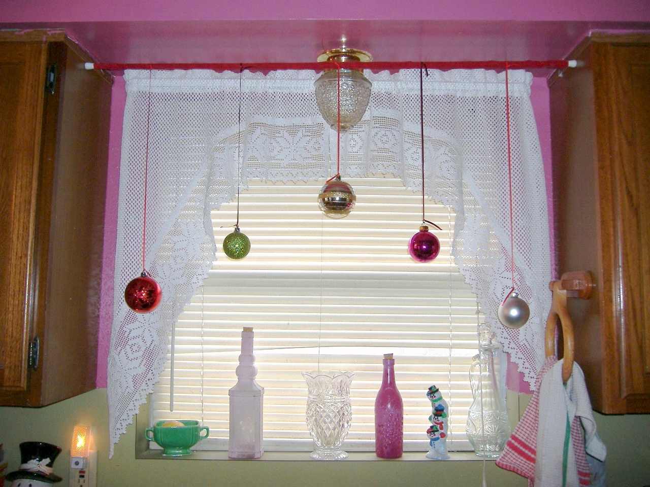 Using simple tension rods, red velvet ribbon, leftover ornaments from ...