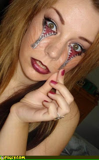Crazy Face Tattoo In Down Eyes