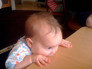 Mason chewing on the table