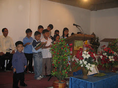 Angel O. Duenas II-my only son (with long sleeve)-standing in front while other kids are singing.