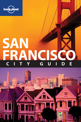 a city guide cover with a bridge and buildings