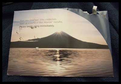 a poster of a mountain and water