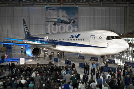 a large group of people in a hangar