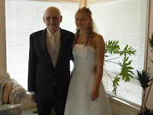 Tegwen in her wedding dress and Dad in a tux