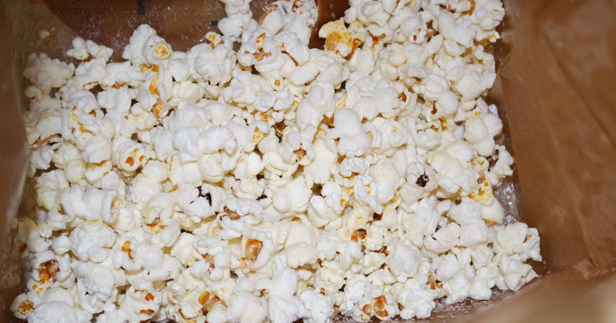 one day at a time making popcorn in a paper bag
