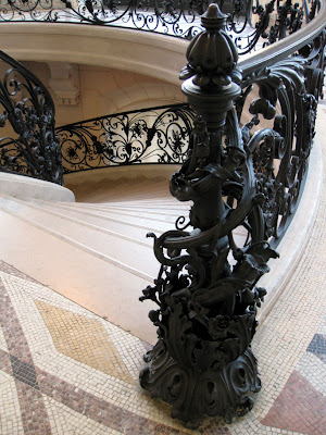 Elaborate wrought iron newel - Le Petit Palais