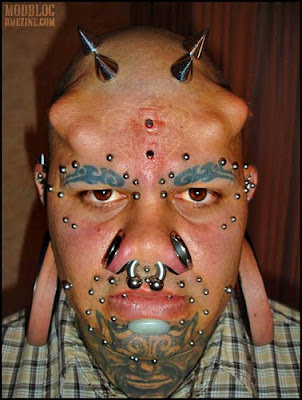 extreme+body+piercing+modification+bull+nose+ring+spikes.jpg