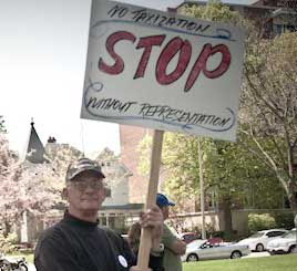 Man holding sign that says No taxization STOP without representation