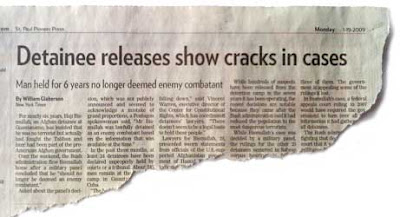 Newspaper clipping with headline that reads Detainee releases show cracks in case