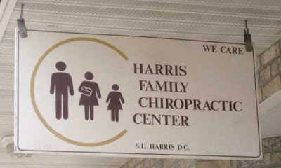 The same Harris Chiropractic sign but the mom figure has a little white bundle in her arms
