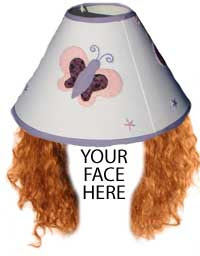 Lampshade with auburn curly hair under it. The words Your Face Here where a face should be
