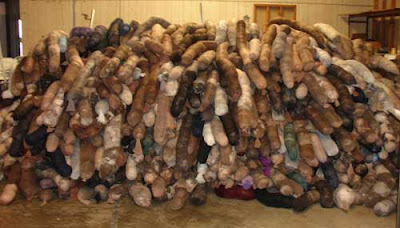 Huge pile of hair booms in a warehouse