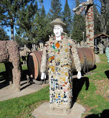 Male statue covered with multi-colored glass