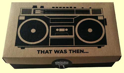 Jambox package, brown shoebox lid with black boombox illustration, black bottom on the box