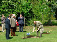 HRH plants a tree