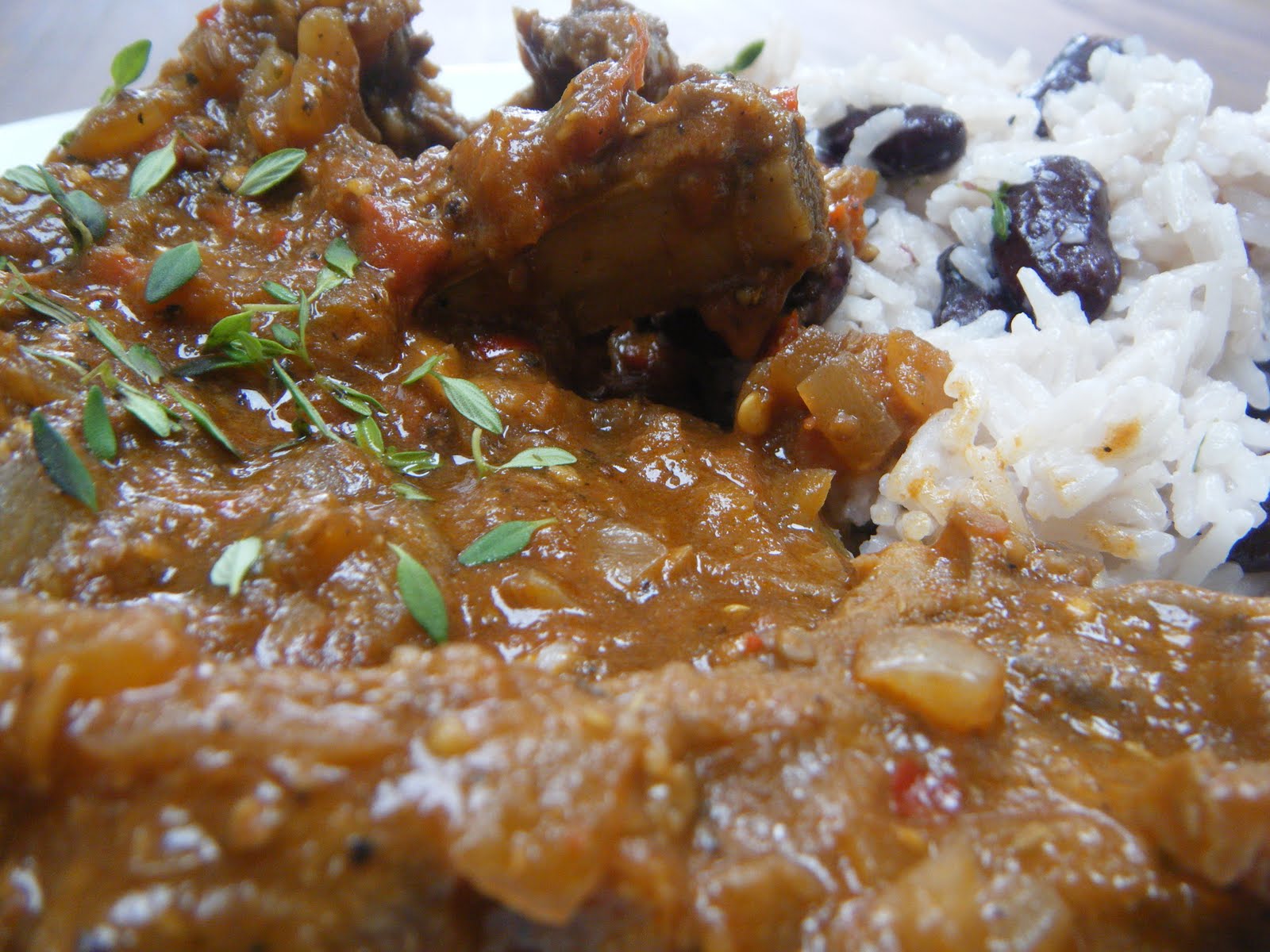 Chicken in a Cherry Sauce Goat curry with rice and peas