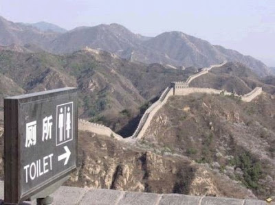 photo of a toilet sign on the great wall of china