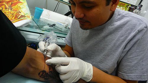 is a selftaught Filipino tattoo artist who has been tattoing since 1994