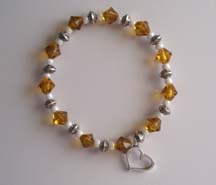 8" Heart Charm & Gold Glass bead Bracelet $25.00