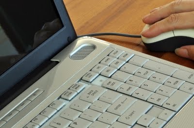 [Laptop_and_hand_on_mouse.jpg]