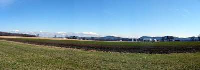 Pan of Hadley MA farmland from the Norwottuck Rail Trail with Mount Holyoke range in the distance