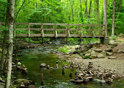 A wooden bridge spanning Amethyst Brook