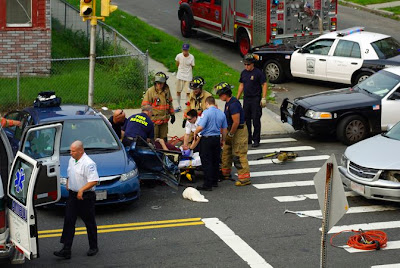 Fire Rescue carefully removing the driver involved in this two car accident at the intersection of Dwight and Linden Streets