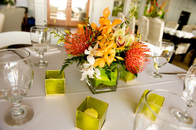 I just wanted to share these amazing red orange tropical centerpieces 