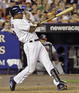 Alou leaning back to reach the inside pitch
