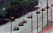 A single man blocks a column of PLA tanks east of Tiananmen Square in Beijing June 5, 1989