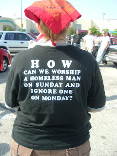 The back of Angela's shirt asks ''How can we worship a homeless man on Sunday and ignore one on Monday?''