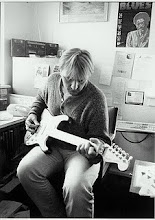 Shoes and one of his WAY too many guitars