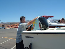 Tyler using my best beach towel to clean his new motor!