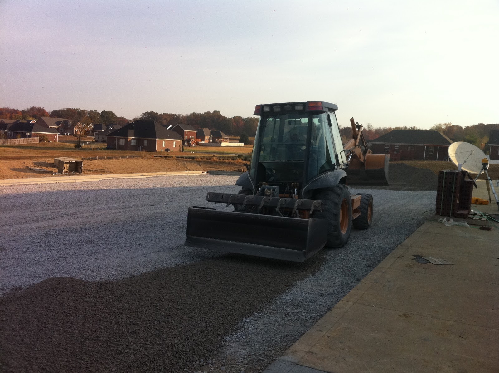 Charlestown LDS Spreading topsoil, hanging sprinkler pipe and asphalt