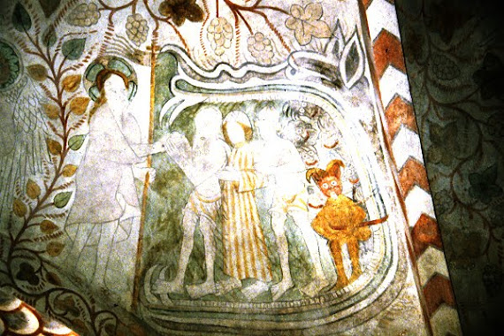 Christ grips Adam's hand as souls are set free from hell.