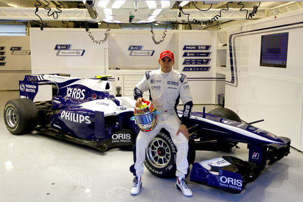 Rubens Barrichello talks to Williams team-mate Pastor Maldonado