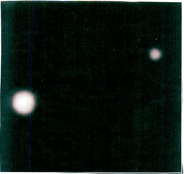 PHOTO OF PLANET plutonium with ITS SATELLITE CARONTE