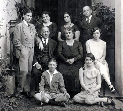 The following picture from 1926 shows Frida to the left in a suit standing