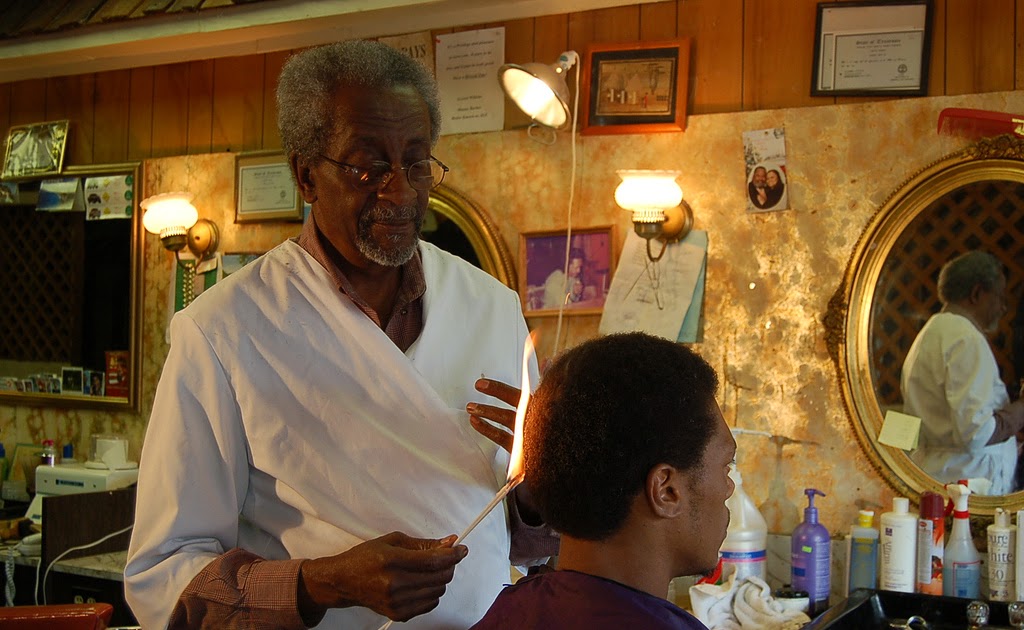 Barber uses fire to cut hair