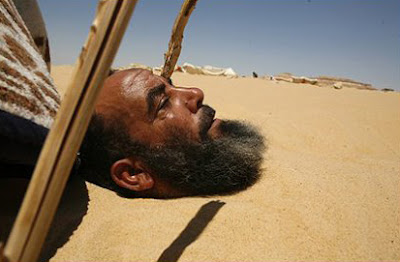 kamal al Masry buried in the sand kamal al Masry buried in the sand