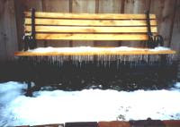 Bench with snow and icicles
