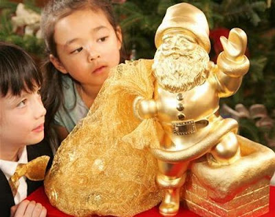 Cute kids with Gold plated Santa Clause hot photo